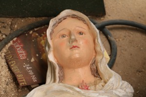 a mother mary statue on the floor at Hassan's factory